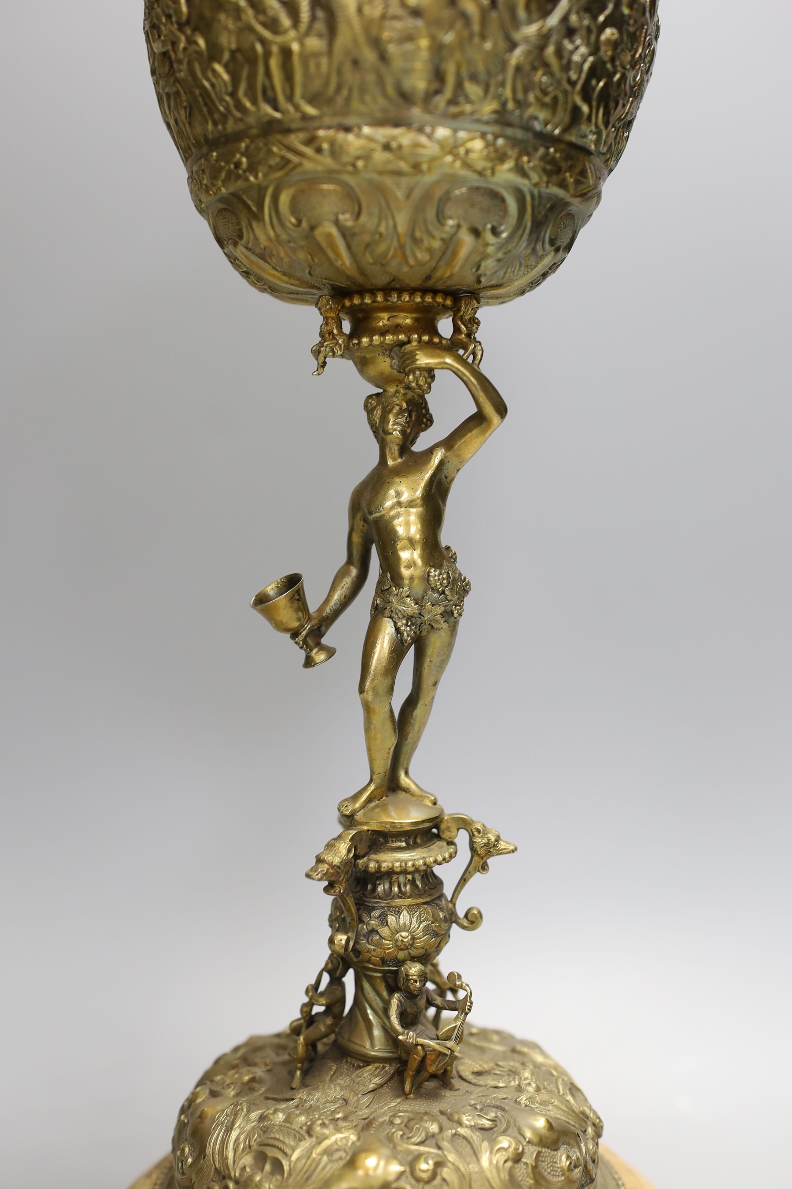 A decorative Bacchus electrotype chalice and cover on stone base - 49cm high